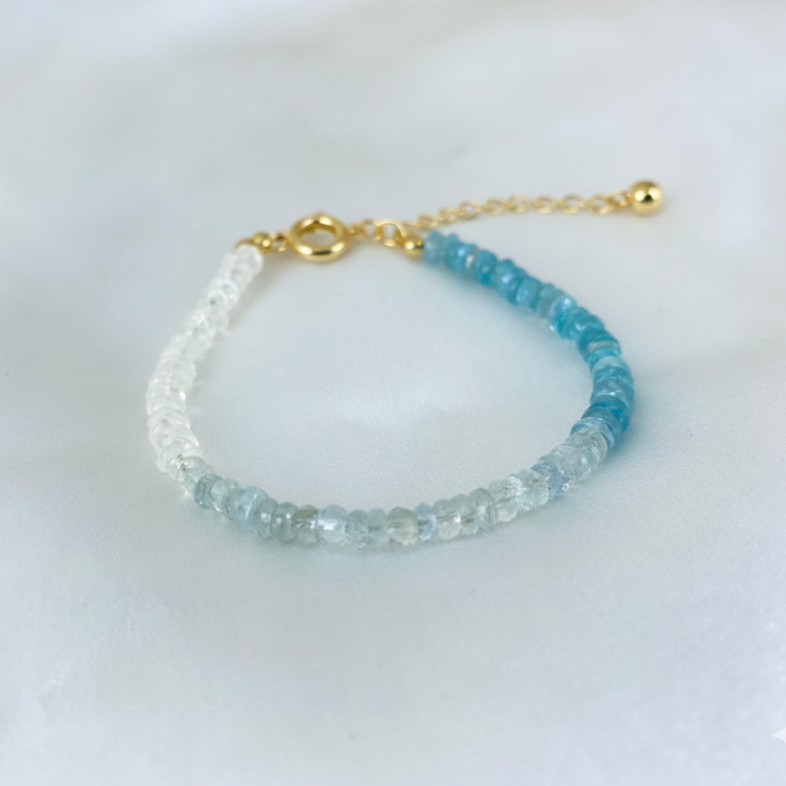 Beaded bracelet with gold clasp on a white background