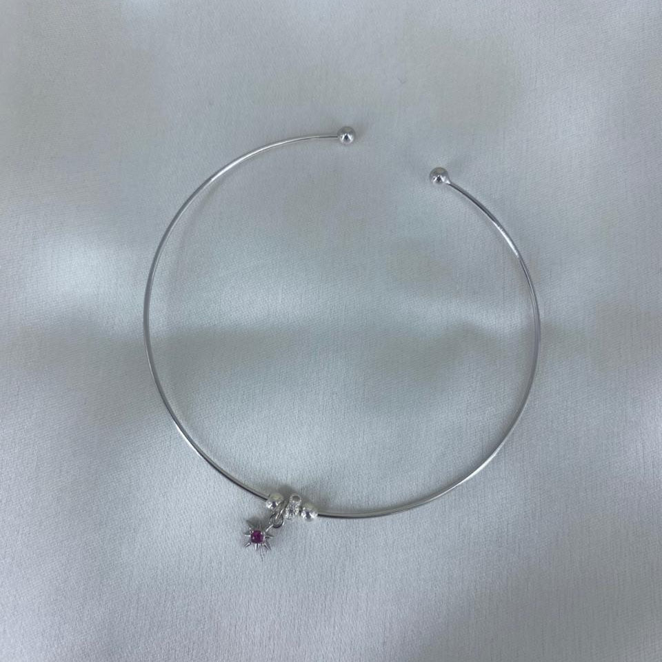 Silver bracelet with a small pendant